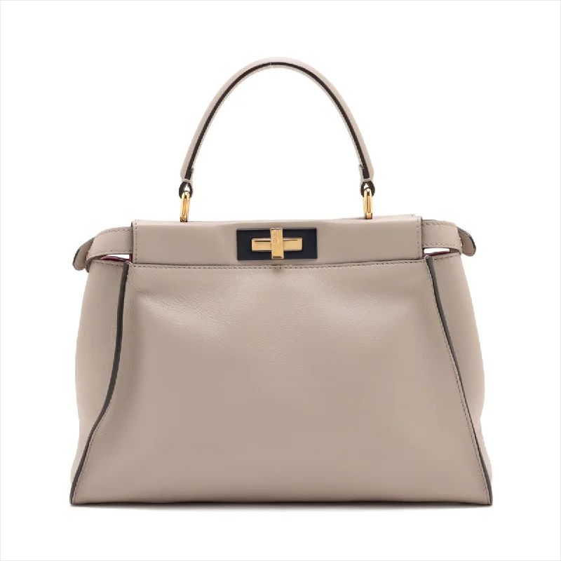 Fendi handbags with a perforated leather detail for a breathable and unique designFENDI Peekaboo Medium in Leather Beige 8BN290